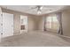 Bedroom featuring plush carpet, ceiling fan and natural light from the windows at 7812 S 67Th Ln, Laveen, AZ 85339