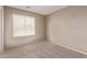 Neutral bedroom with one window providing natural light, and plush carpet at 7812 S 67Th Ln, Laveen, AZ 85339