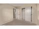 Bedroom with plush carpet, closet with sliding doors, and neutral colors at 7812 S 67Th Ln, Laveen, AZ 85339