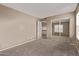 Bedroom with plush carpet, closet with mirrored doors, and neutral colors at 7812 S 67Th Ln, Laveen, AZ 85339