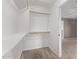 Walk-in closet with carpeted floors, shelving and wood racks for storage at 7812 S 67Th Ln, Laveen, AZ 85339