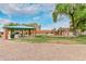 Neighborhood park featuring a shaded picnic area and colorful playground equipment in a well-maintained green space at 7812 S 67Th Ln, Laveen, AZ 85339