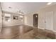Spacious living room featuring hardwood floors, neutral paint, and multiple windows providing ample natural light at 7812 S 67Th Ln, Laveen, AZ 85339