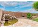 Charming backyard water feature with stacked stones and lush landscaping, adding tranquility to the outdoor space at 7812 S 67Th Ln, Laveen, AZ 85339