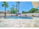 Beautiful backyard featuring a private pool, manicured landscaping, travertine decking, and privacy wall at 8525 E Vía De Los Libros --, Scottsdale, AZ 85258