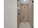 A tiled shower with glass doors and modern fixtures at 8525 E Vía De Los Libros --, Scottsdale, AZ 85258