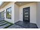 Inviting front entrance featuring a modern door, stylish sidelights, and a well-manicured walkway for enhanced curb appeal at 8525 E Vía De Los Libros --, Scottsdale, AZ 85258