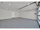 Bright garage with epoxy floors, and modern lighting, offering ample space for vehicles or storage at 8525 E Vía De Los Libros --, Scottsdale, AZ 85258