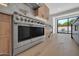 Modern kitchen with stainless steel range and light wood cabinets with under cabinet lighting at 8525 E Vía De Los Libros --, Scottsdale, AZ 85258