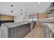 Modern kitchen featuring a large center island with a sink, stainless steel appliances, and ample cabinet space at 8525 E Vía De Los Libros --, Scottsdale, AZ 85258