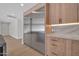 Kitchen with stainless steel refrigerator and light wood cabinets with under cabinet lighting at 8525 E Vía De Los Libros --, Scottsdale, AZ 85258
