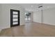 Bright living room features a modern light fixture and light hardwood flooring at 8525 E Vía De Los Libros --, Scottsdale, AZ 85258