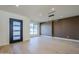 Bright living room featuring hardwood floors, modern lighting fixtures, and a large window that provides natural light and views at 8525 E Vía De Los Libros --, Scottsdale, AZ 85258