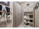 Bathroom with decorative shower curtain, towels, and built in shelving at 8934 E Calle Buena Vis, Scottsdale, AZ 85255