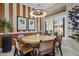 Cozy dining area with unique light fixture, wood table, and modern chairs at 8934 E Calle Buena Vis, Scottsdale, AZ 85255