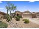 Charming single-story home with desert landscaping, cacti, and a two-car garage at 8934 E Calle Buena Vis, Scottsdale, AZ 85255