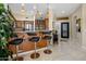 Open kitchen with stainless steel appliances, breakfast bar, and pendant lighting fixtures at 8934 E Calle Buena Vis, Scottsdale, AZ 85255