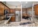 Bright kitchen with stainless steel appliances, granite counters, and adjacent breakfast nook at 8934 E Calle Buena Vis, Scottsdale, AZ 85255