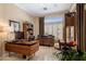Home office with modern desk, bright window, and minimalist decor at 8934 E Calle Buena Vis, Scottsdale, AZ 85255
