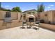 This outdoor kitchen is beautifully equipped with a stainless grill, and brick fireplace for outdoor entertaining at 8934 E Calle Buena Vis, Scottsdale, AZ 85255