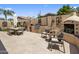 This outdoor kitchen has a built in grill and a fireplace with plenty of room for dining and relaxation at 8934 E Calle Buena Vis, Scottsdale, AZ 85255