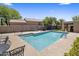Enjoy this sparkling community pool with comfortable seating and desert landscaping at 8934 E Calle Buena Vis, Scottsdale, AZ 85255