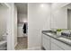 Bathroom featuring a double vanity, walk-in closet and a toilet at 9331 S Mineros Dr, Apache Junction, AZ 85120