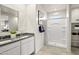 Bathroom with double vanity, granite countertop, and a walk-in shower at 9331 S Mineros Dr, Apache Junction, AZ 85120