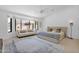 Bright bedroom with a large window, comfortable seating, and a stylish rug at 9477 E Rosemonte Dr, Scottsdale, AZ 85255
