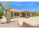 Beautiful home featuring desert landscaping, a covered patio and seamless indoor-outdoor living at 9477 E Rosemonte Dr, Scottsdale, AZ 85255