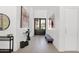 Bright, open foyer featuring clean lines, wood-look tile and modern furnishings at 9477 E Rosemonte Dr, Scottsdale, AZ 85255