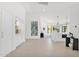 Bright living room with vaulted ceiling, modern lighting, and light wood floors at 9477 E Rosemonte Dr, Scottsdale, AZ 85255