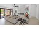 Airy living room with modern fireplace, tile flooring, and neutral furniture at 9477 E Rosemonte Dr, Scottsdale, AZ 85255