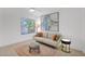 Bright living room with comfortable seating, contemporary art, and stylish decor at 9477 E Rosemonte Dr, Scottsdale, AZ 85255