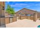 Outdoor kitchen featuring a built-in grill, sink, and refrigeration for alfresco dining at 9477 E Rosemonte Dr, Scottsdale, AZ 85255