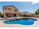 Inviting backyard features sparkling pool, spacious patio and grassy area, perfect for outdoor living at 10440 E Osage Ave, Mesa, AZ 85212