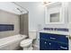 Stylish bathroom features a shower-tub combo, vanity with sink, and gray plank flooring at 10440 E Osage Ave, Mesa, AZ 85212