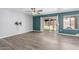 Bedroom featuring sliding glass doors to the outdoor area and sleek ceiling fan at 10440 E Osage Ave, Mesa, AZ 85212