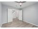 Spacious bedroom featuring vinyl plank flooring, baseboards, and large double door closet at 10440 E Osage Ave, Mesa, AZ 85212