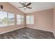 Light-filled bedroom features a vaulted ceiling and three windows for ample natural light at 10440 E Osage Ave, Mesa, AZ 85212