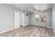Spacious bedroom offers a ceiling fan, two windows, and vinyl plank flooring at 10440 E Osage Ave, Mesa, AZ 85212