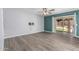 Spacious bedroom with hardwood floors and a sliding glass door to the backyard at 10440 E Osage Ave, Mesa, AZ 85212