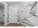 Bright entryway featuring luxury vinyl plank floors and staircase with modern railings at 10440 E Osage Ave, Mesa, AZ 85212
