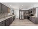 Charming kitchen with stainless steel appliances, mosaic backsplash, granite countertops, and light wood floors at 10440 E Osage Ave, Mesa, AZ 85212