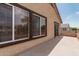 This outdoor patio features dual windows, an outdoor patio, and an overhang for shade at 10440 E Osage Ave, Mesa, AZ 85212