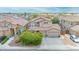 Stunning aerial view of a well-maintained home showcasing the three-car garage and landscaped yard at 10613 E Knowles Ave, Mesa, AZ 85209