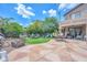 Expansive backyard with a well-maintained lawn, stone patio, and outdoor seating area, great for entertaining at 10613 E Knowles Ave, Mesa, AZ 85209