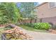 Backyard with a charming rock waterfall feature and lush, mature landscaping at 10613 E Knowles Ave, Mesa, AZ 85209