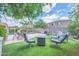 Lovely backyard with outdoor seating, a barbecue grill and beautiful landscaping, perfect for outdoor gatherings at 10613 E Knowles Ave, Mesa, AZ 85209