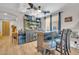 Stylish bar area with custom cabinetry, seating, and ample space for drinks and entertaining at 10613 E Knowles Ave, Mesa, AZ 85209